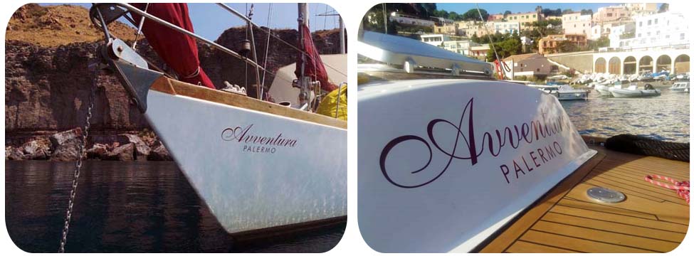 Dettagli di prua e poppa con il nome della barca a vela Avventura